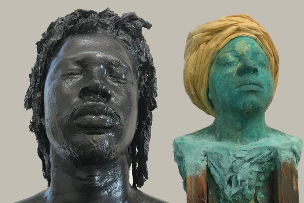 two sculpture busts (man on the left, woman on the right)